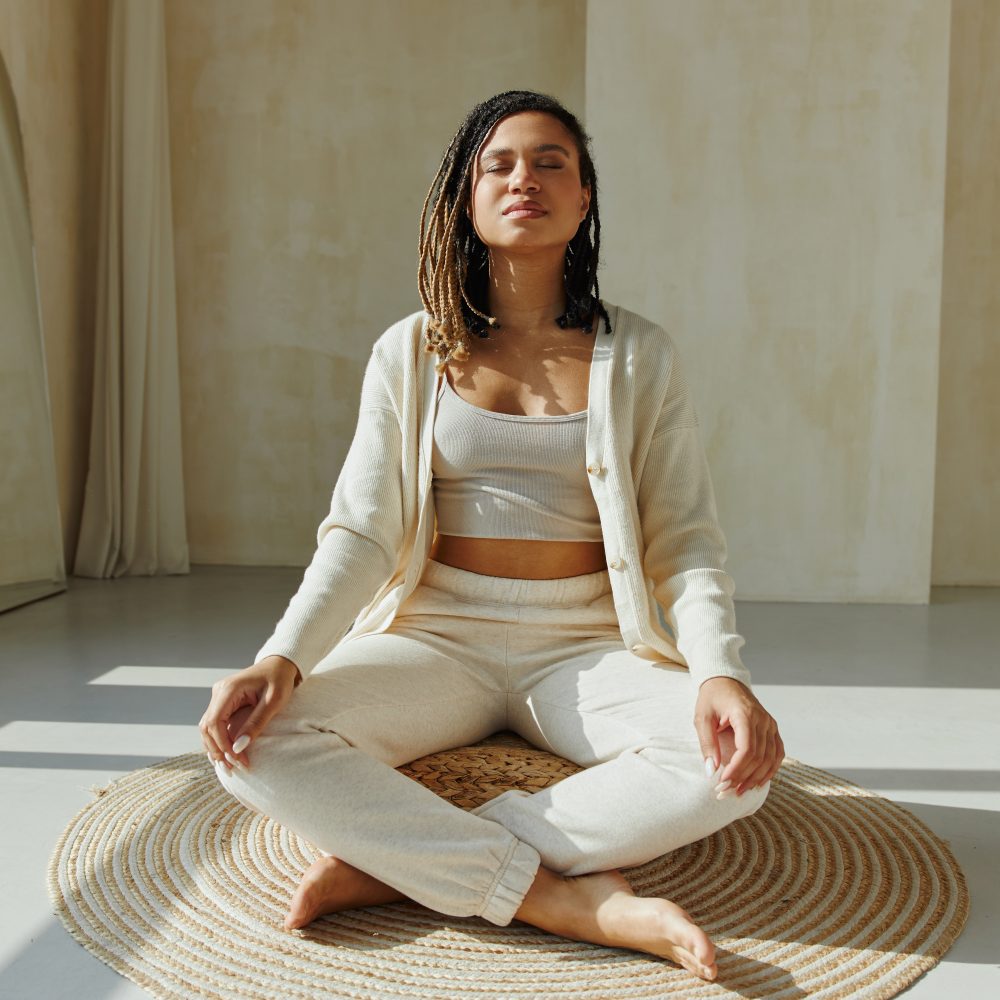 Young black woman practicing meditation.